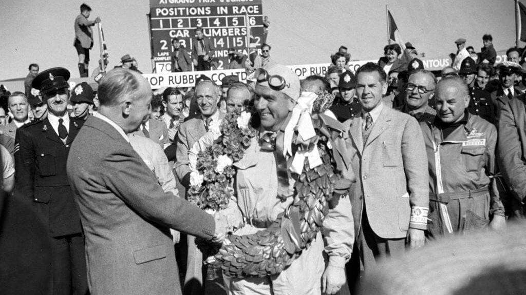 Giuseppe Farina is congratulated on his victory during the British GP at Silverstone Circuit on Saturday May 13th, 1950 i Northamptonshire, United Kingdom Photo by Michael Tee/LAT Images Editorial #2167398762