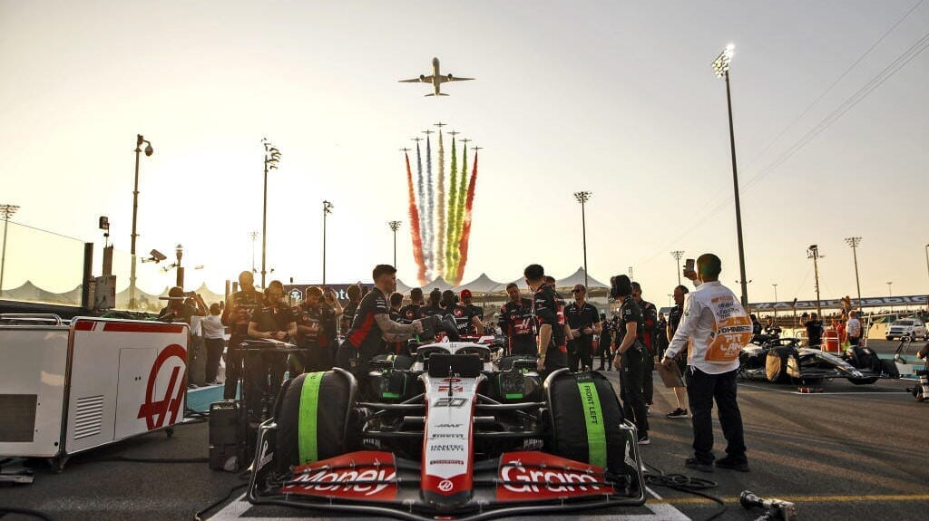F1 car on track with jets overhead