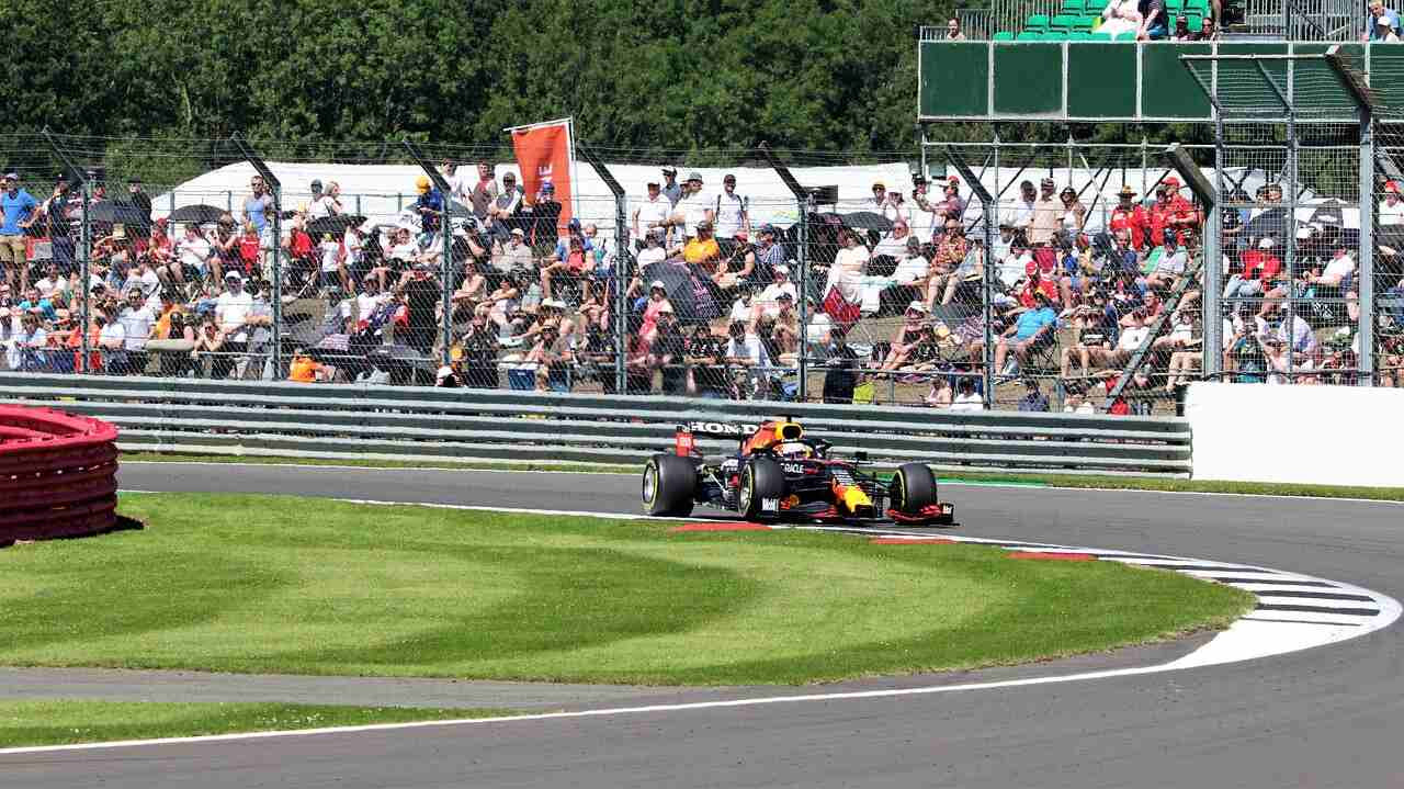 Max Verstappen black and yellow car on track