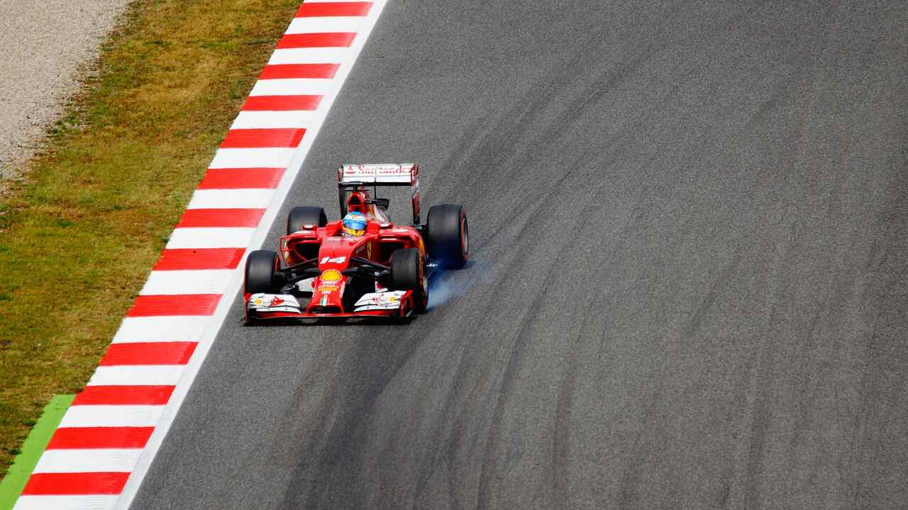 red car racing down track