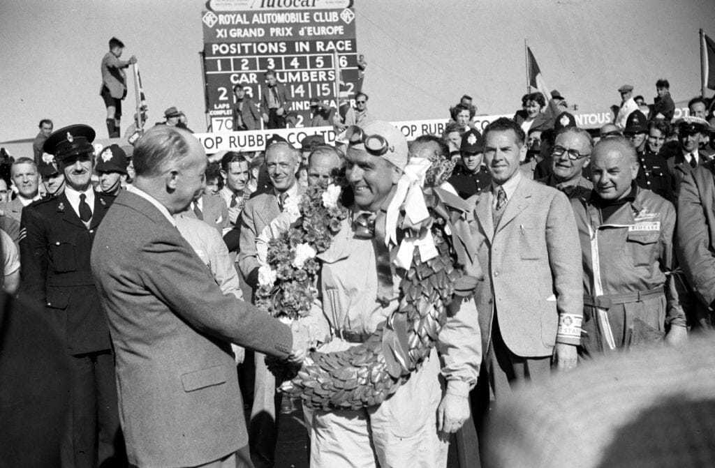 Giuseppe Farina is congratulated on his victory during the British GP at  Silverstone Circuit on Saturday May 13th, 1950 i Northamptonshire, United Kingdom Photo by Michael Tee/LAT Images Editorial #2167398762