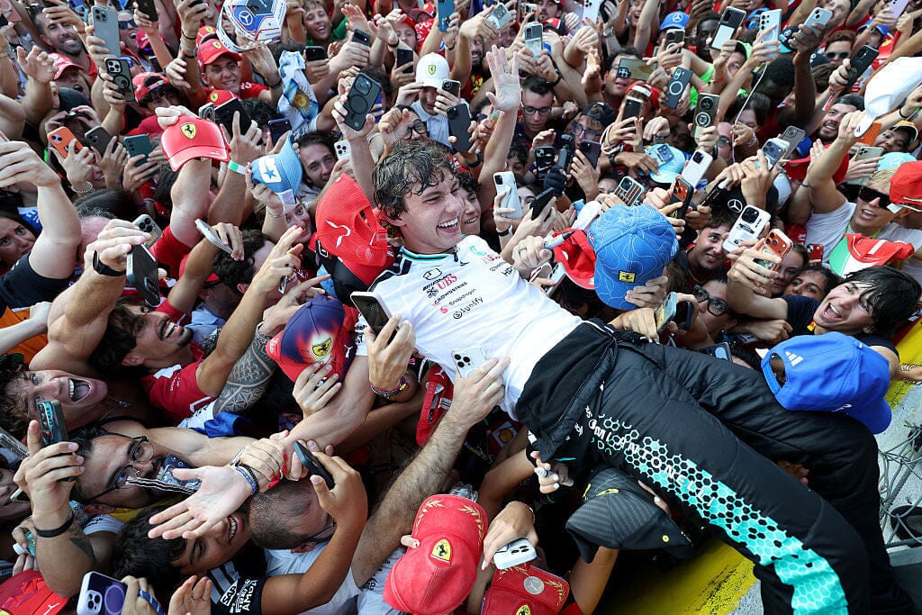 Kimi Antonelli crowd surfs with fans after winning the 2026 Italian Grand Prix at Monza