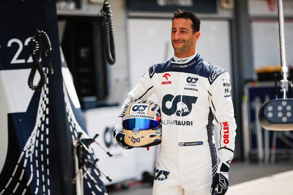 Daniel Ricciardo holding his helmet